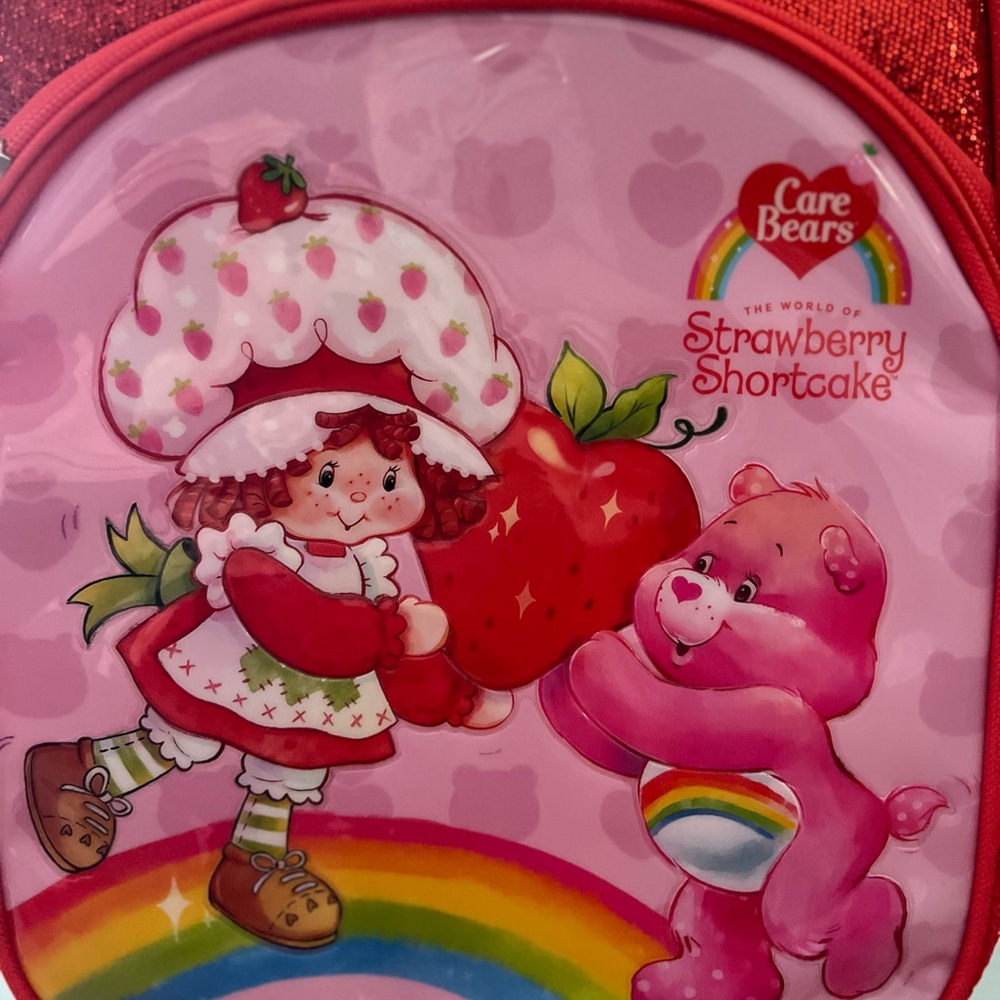 Care Bears and Strawberry Shortcake carry on luggage and backpack.